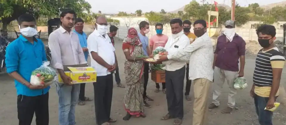 Volunteers distributing fresh food supplies in a community